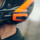 Cardo PackTalk Edge KTM affixed to a helmet