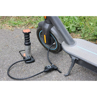 Mini Foot Pump with Digital Manometer in use on a scooter tyre