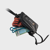 A Giant Loop Pannier Pocket with contents spilling out