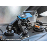 Quad Lock Vibration Dampener centre on a bike