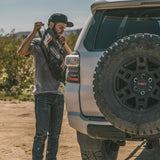 Giant Loop Gas Bag Fuel Safe Bladder in use being poured into a 4WD