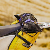 Giant Loop Gas Bag Fuel Safe Bladder strapped to the rear of a motorcycle