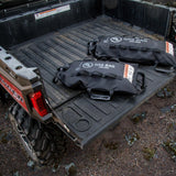 Two Giant Loop Gas Bag Fuel Safe Bladders full, lying on rear of ute