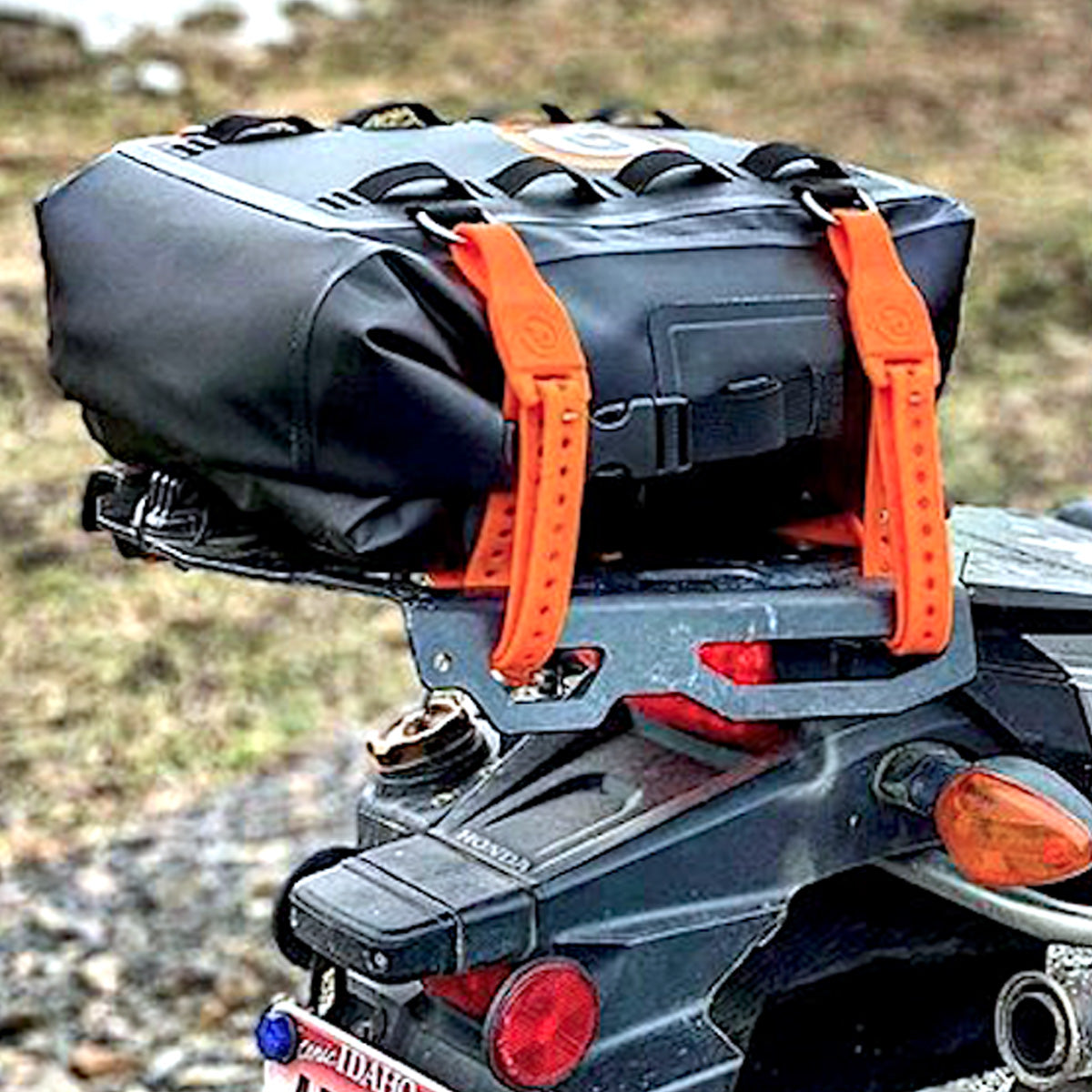 Giant Loop Revelstoke Dry Bag with possibles pouch strapped to motorcycle