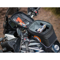 Giant Loop Diablo Tank Bag fitted to bike and open showing partially filled contents