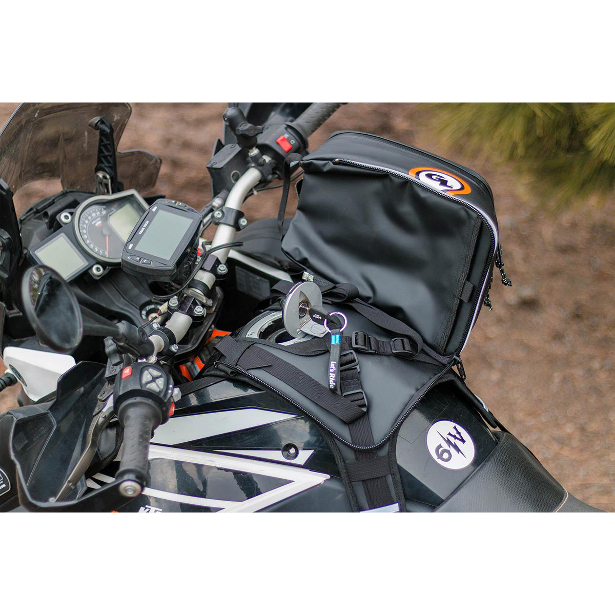 Giant Loop Diablo Tank Bag fitted to bike and unzipped to show easy access to fuel