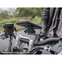 Quad Lock Vibration Dampener on a bike with phone
