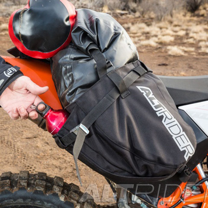 AltRider Hemisphere Saddlebag in use, rider retrieving bottle from carrier