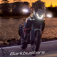 Barkbusters LED Handguard Lights on a motorcycle at twilight